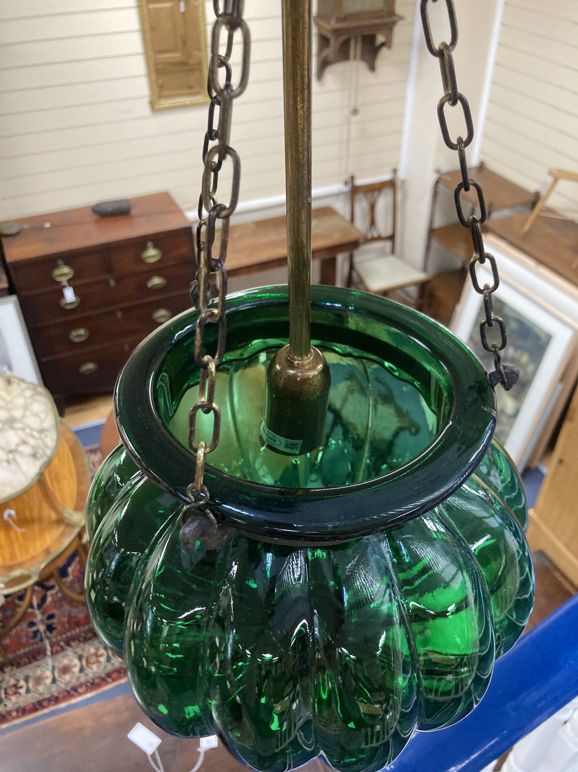 A ribbed green glass ceiling shade, height 50cm